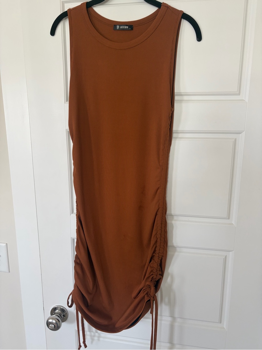 Ribbed rust/tan midi dress with side ruching, adjustable length tie ups